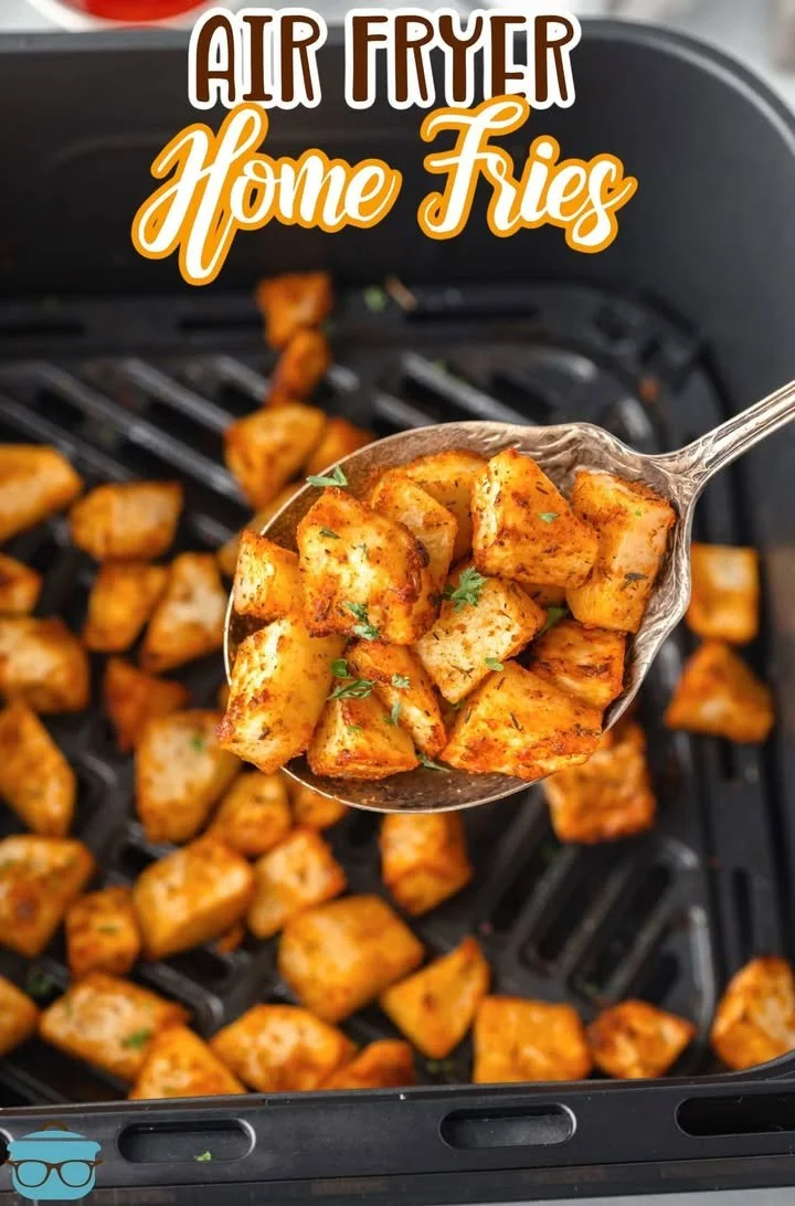 Crispy air fryer home fries served in a bowl with herbs