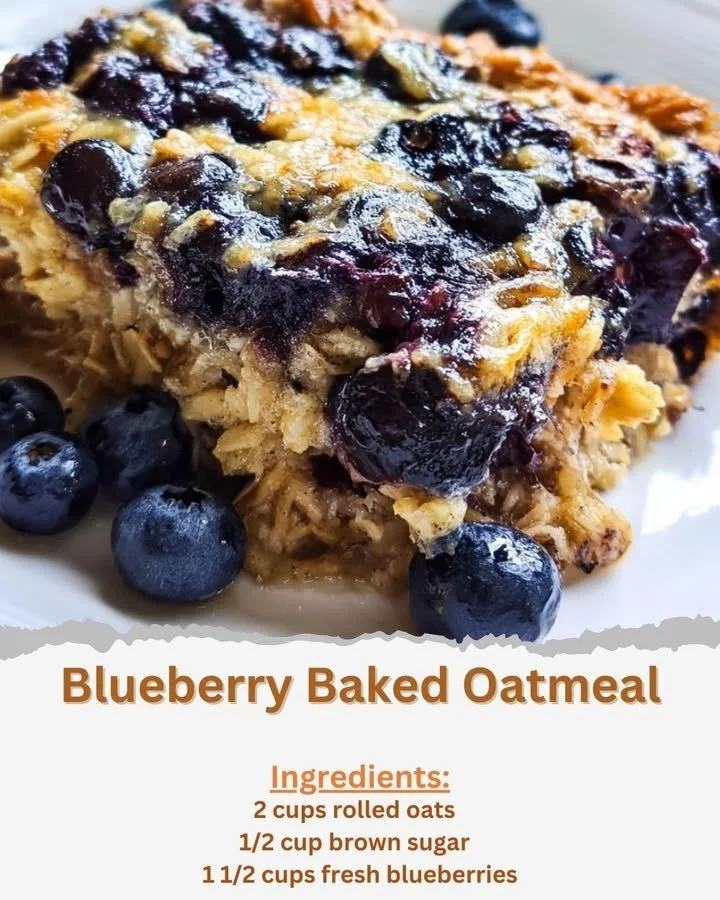A bowl of warm blueberry baked oatmeal topped with fresh berries and nuts.