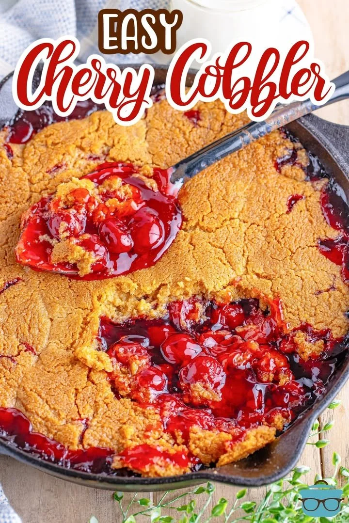 Freshly baked cherry cobbler topped with a flaky crust and served with vanilla ice cream.