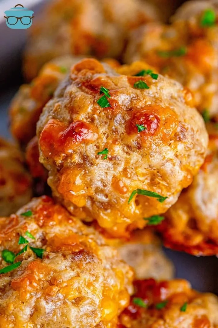 Cream Cheese Sausage Balls Plate of cream cheese sausage balls garnished with herbs