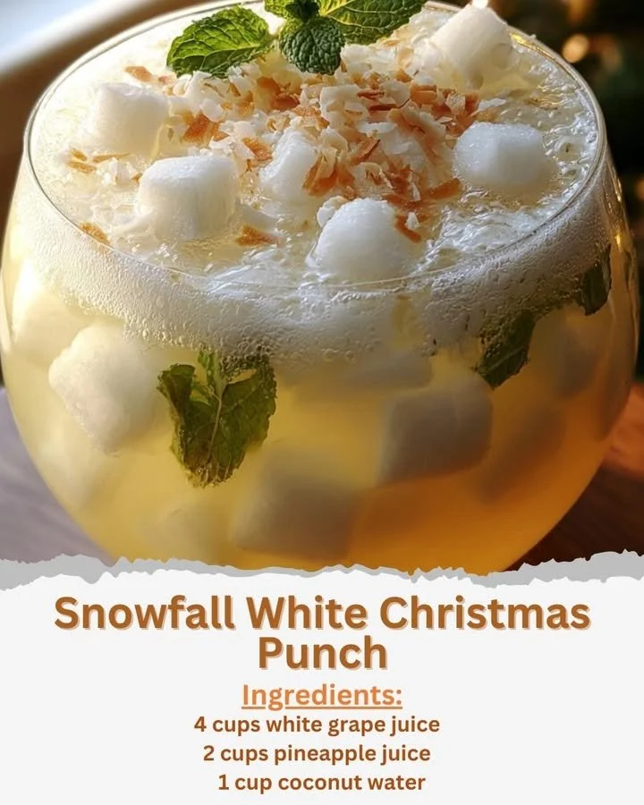 Snowfall White Christmas Punch Snowfall White Christmas Punch in a festive glass with holiday decor